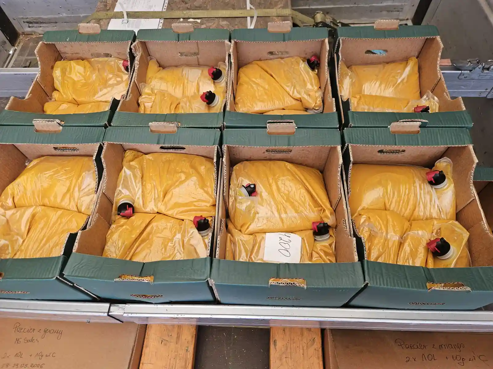 Mango pulp BIB cartons stacked in warehouse – MG SALES stock Poland